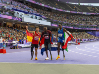 STRENG Felix of Germany (L), Sherman Isidro Guity Guity of Costa Rica (C), and MANU Maxcel Amo of Italy (R) react after the Men's 100m - T64...