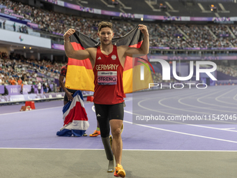 Felix Streng of Germany reacts after winning the bronze medal in the Men's 100m - T64 Final at Stade de France during the Paris 2024 Paralym...