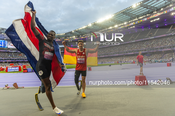 STRENG Felix of Germany (R) and Sherman Isidro Guity Guity of Costa Rica (L) react after the Men's 100m - T64 Final at Stade de France durin...