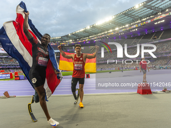 STRENG Felix of Germany (R) and Sherman Isidro Guity Guity of Costa Rica (L) react after the Men's 100m - T64 Final at Stade de France durin...