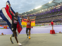 STRENG Felix of Germany (R) and Sherman Isidro Guity Guity of Costa Rica (L) react after the Men's 100m - T64 Final at Stade de France durin...