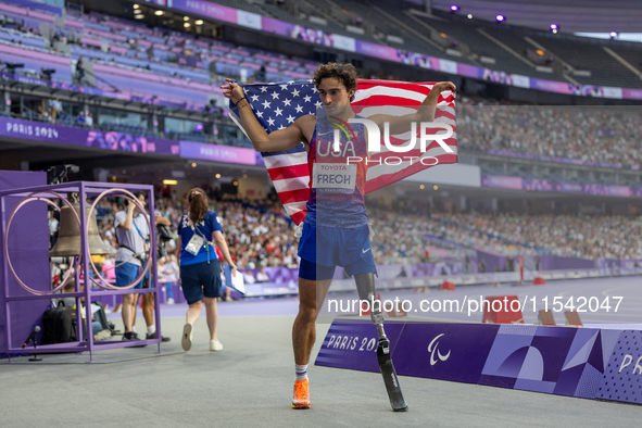 Ezra Frech of the United States of America reacts after winning the gold medal during the Men's 100m - T63 Final at Stade de France during t...