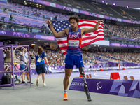 Ezra Frech of the United States of America reacts after winning the gold medal during the Men's 100m - T63 Final at Stade de France during t...