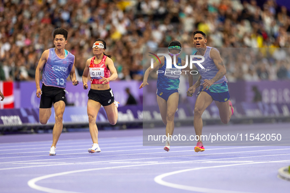 Jerusa Geber Dos Santos and her guide Gabriel Aparecido Santos Garcia of Team Brasil compete in the Women's 100m - T11 Semi-Finals at Stade...