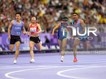 Jerusa Geber Dos Santos and her guide Gabriel Aparecido Santos Garcia of Team Brasil compete in the Women's 100m - T11 Semi-Finals at Stade...