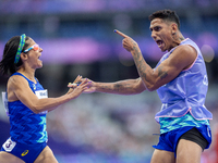 Jerusa Geber Dos Santos and her guide Gabriel Aparecido Santos Garcia of Team Brasil react after qualifying with the world record to Women's...