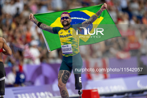 Vinicius Goncalves Rodrigues of Team Brazil reacts after winning the bronze medal in the Men's 100m - T63 Final at Stade de France during th...