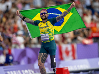 Vinicius Goncalves Rodrigues of Team Brazil reacts after winning the bronze medal in the Men's 100m - T63 Final at Stade de France during th...