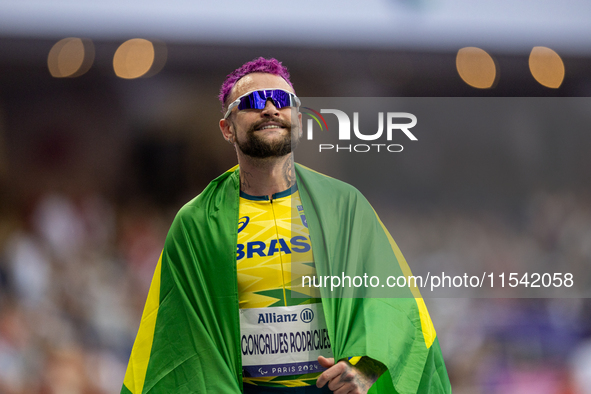 Vinicius Goncalves Rodrigues of Team Brazil reacts after winning the bronze medal in the Men's 100m - T63 Final at Stade de France during th...