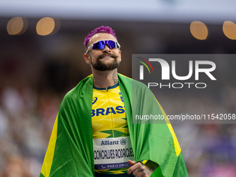 Vinicius Goncalves Rodrigues of Team Brazil reacts after winning the bronze medal in the Men's 100m - T63 Final at Stade de France during th...