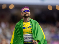 Vinicius Goncalves Rodrigues of Team Brazil reacts after winning the bronze medal in the Men's 100m - T63 Final at Stade de France during th...