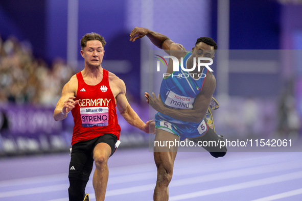 Maxcel Amo Manu of Italy (right) and Felix Streng of Germany (left) compete in the Men's 100m - T64 Final at Stade de France during the Pari...