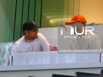 NBA star Stephen Curry sits in the owner's box during the baseball game against the Boston Red Sox at Citi Field in Corona, N.Y., on Septemb...