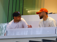 NBA star Stephen Curry sits in the owner's box during the baseball game against the Boston Red Sox at Citi Field in Corona, N.Y., on Septemb...