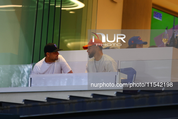 NBA star Stephen Curry sits in the owner's box during the baseball game against the Boston Red Sox at Citi Field in Corona, N.Y., on Septemb...