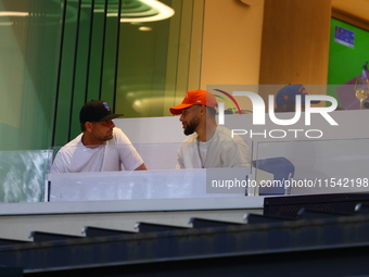 NBA star Stephen Curry sits in the owner's box during the baseball game against the Boston Red Sox at Citi Field in Corona, N.Y., on Septemb...