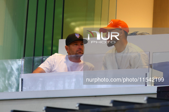 NBA star Stephen Curry sits in the owner's box during the baseball game against the Boston Red Sox at Citi Field in Corona, N.Y., on Septemb...