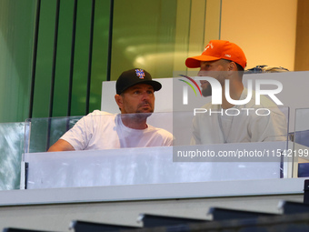 NBA star Stephen Curry sits in the owner's box during the baseball game against the Boston Red Sox at Citi Field in Corona, N.Y., on Septemb...