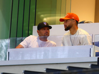 NBA star Stephen Curry sits in the owner's box during the baseball game against the Boston Red Sox at Citi Field in Corona, N.Y., on Septemb...