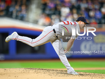 Boston Red Sox pitcher Josh Winckowski #25 throws during the sixth inning of the baseball game against the New York Mets at Citi Field in Co...