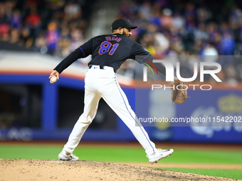 New York Mets relief pitcher Danny Young #81 throws during the eighth inning of the baseball game against the Boston Red Sox at Citi Field i...