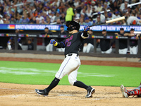 Luis Torrens #13 of the New York Mets doubles during the fourth inning of the baseball game against the Boston Red Sox at Citi Field in Coro...