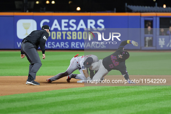 Luis Torrens #13 of the New York Mets doubles during the seventh inning of the baseball game against the Boston Red Sox at Citi Field in Cor...