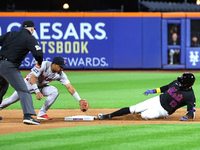 Luis Torrens #13 of the New York Mets doubles during the seventh inning of the baseball game against the Boston Red Sox at Citi Field in Cor...