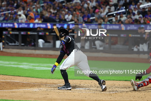 Luis Torrens #13 of the New York Mets doubles during the seventh inning of the baseball game against the Boston Red Sox at Citi Field in Cor...