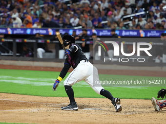 Luis Torrens #13 of the New York Mets doubles during the seventh inning of the baseball game against the Boston Red Sox at Citi Field in Cor...