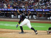 Luis Torrens #13 of the New York Mets doubles during the seventh inning of the baseball game against the Boston Red Sox at Citi Field in Cor...