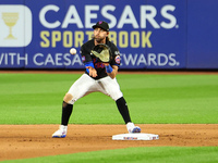 New York Mets second baseman Jeff McNeil takes the throw from third base and relays to first base for the double play during the fifth innin...