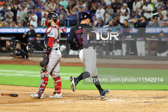 Luis Torrens #13 of the New York Mets scores from second base during the fourth inning of the baseball game against the Boston Red Sox at Ci...