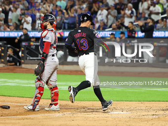 Luis Torrens #13 of the New York Mets scores from second base during the fourth inning of the baseball game against the Boston Red Sox at Ci...