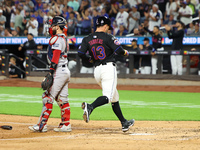 Luis Torrens #13 of the New York Mets scores from second base during the fourth inning of the baseball game against the Boston Red Sox at Ci...