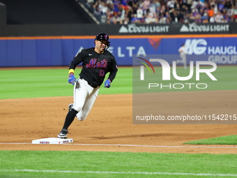 Luis Torrens #13 of the New York Mets scores from second base during the fourth inning of the baseball game against the Boston Red Sox at Ci...