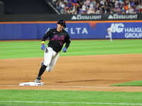 Luis Torrens #13 of the New York Mets scores from second base during the fourth inning of the baseball game against the Boston Red Sox at Ci...