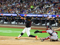 Francisco Lindor #12 of the New York Mets singles during the fourth inning of the baseball game against the Boston Red Sox at Citi Field in...