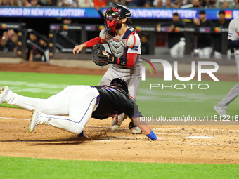 New York Mets DJ Stewart #29 scores from 2B during the fourth inning of the baseball game against the Boston Red Sox at Citi Field in Corona...