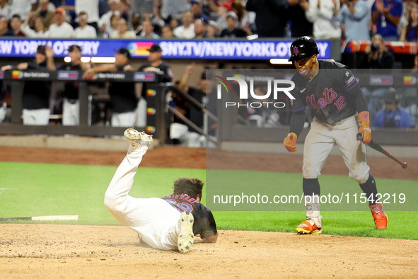 New York Mets DJ Stewart #29 scores from 2B during the fourth inning of the baseball game against the Boston Red Sox at Citi Field in Corona...