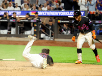 New York Mets DJ Stewart #29 scores from 2B during the fourth inning of the baseball game against the Boston Red Sox at Citi Field in Corona...