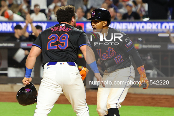 New York Mets DJ Stewart #29 scores from 2B during the fourth inning of the baseball game against the Boston Red Sox at Citi Field in Corona...