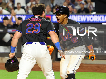 New York Mets DJ Stewart #29 scores from 2B during the fourth inning of the baseball game against the Boston Red Sox at Citi Field in Corona...