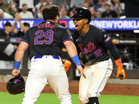 New York Mets DJ Stewart #29 scores from 2B during the fourth inning of the baseball game against the Boston Red Sox at Citi Field in Corona...