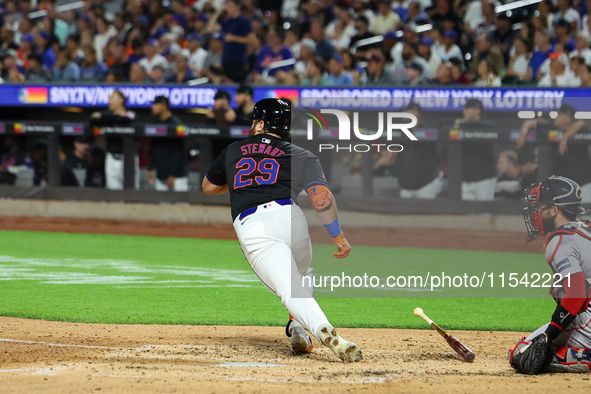 New York Mets DJ Stewart #29 singles during the fourth inning of the baseball game against the Boston Red Sox at Citi Field in Corona, N.Y.,...