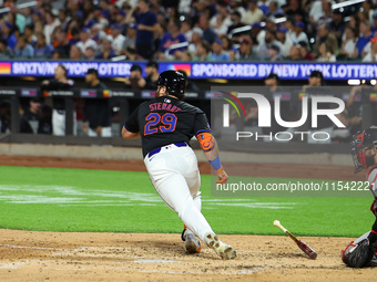 New York Mets DJ Stewart #29 singles during the fourth inning of the baseball game against the Boston Red Sox at Citi Field in Corona, N.Y.,...