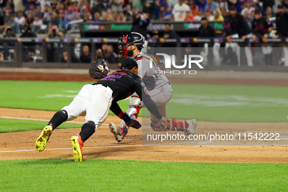 Francisco Lindor #12 of the New York Mets scores from second base during the third inning of the baseball game against the Boston Red Sox at...