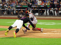 Francisco Lindor #12 of the New York Mets scores from second base during the third inning of the baseball game against the Boston Red Sox at...