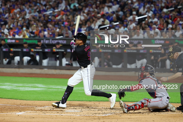 Brandon Nimmo #9 of the New York Mets doubles during the third inning of the baseball game against the Boston Red Sox at Citi Field in Coron...