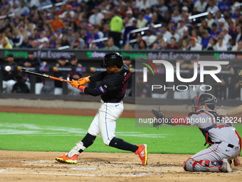 Francisco Lindor #12 of the New York Mets singles during the third inning of the baseball game against the Boston Red Sox at Citi Field in C...